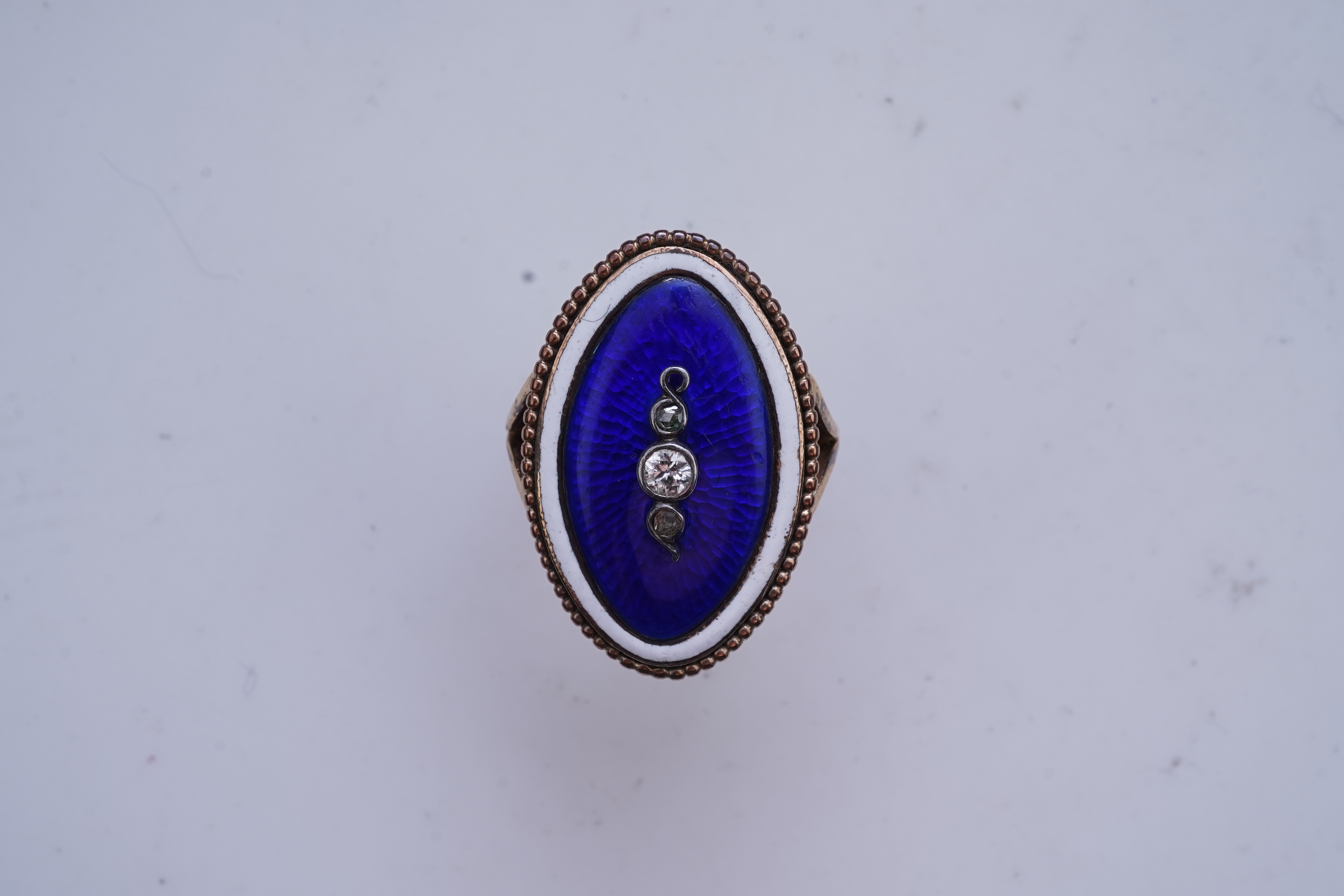 An enamel and diamond mourning ring, late 19th century